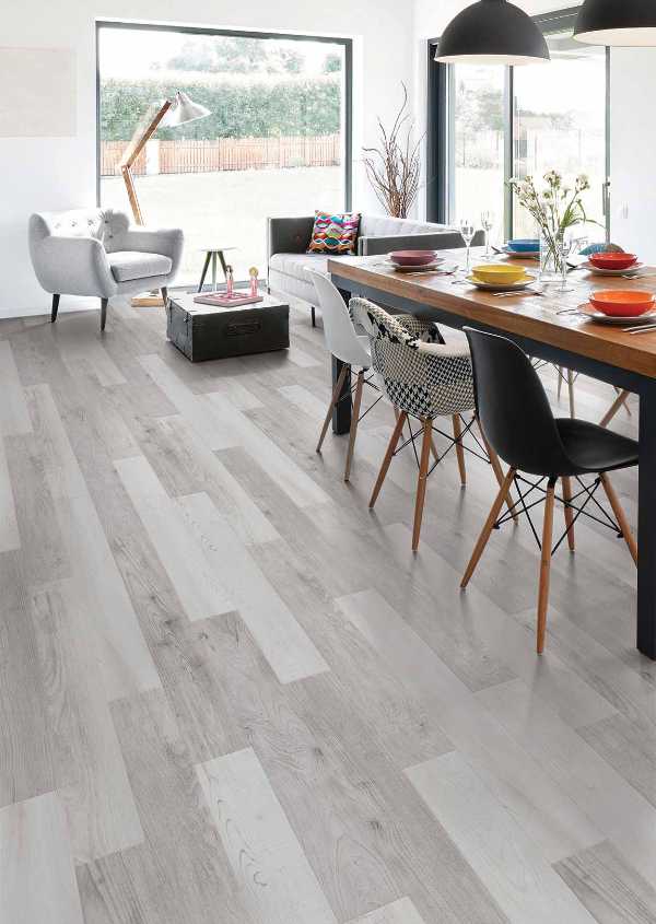 eclectic dining area with gray vinyl plank floors